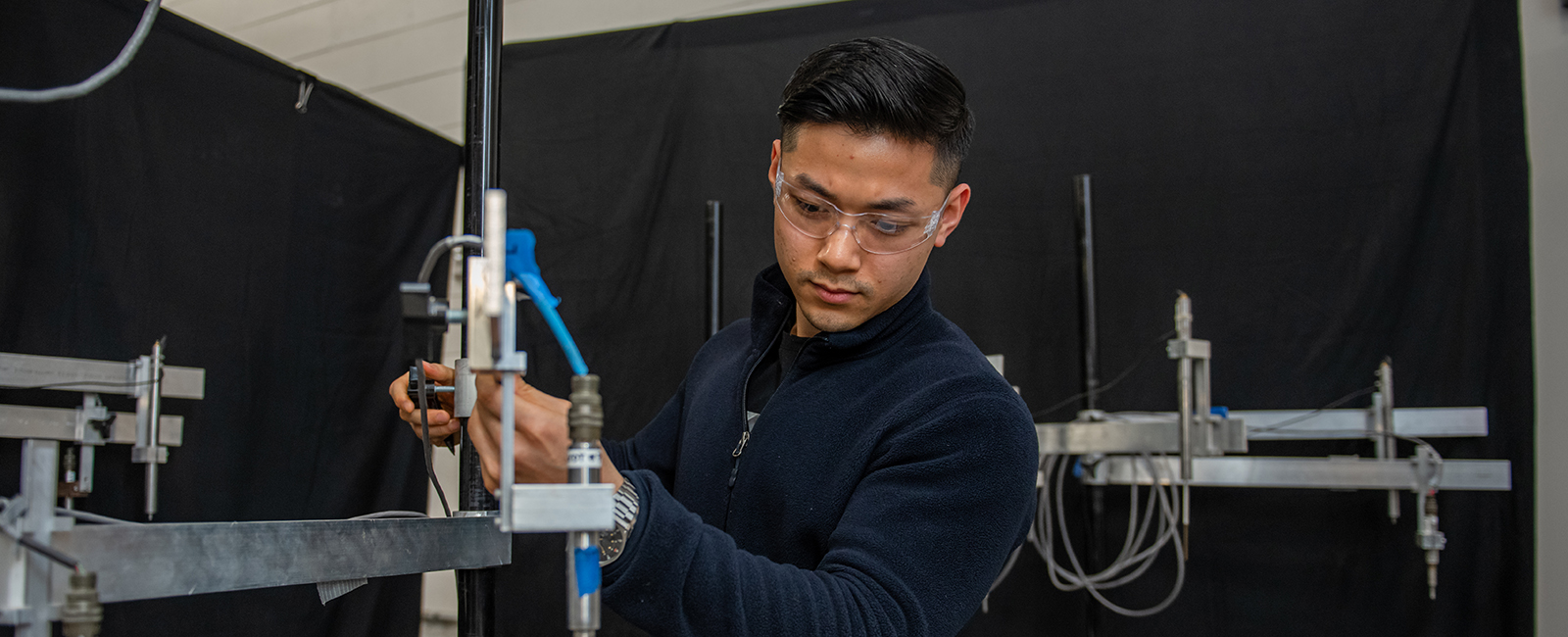 Student performs an experiment in the structures lab